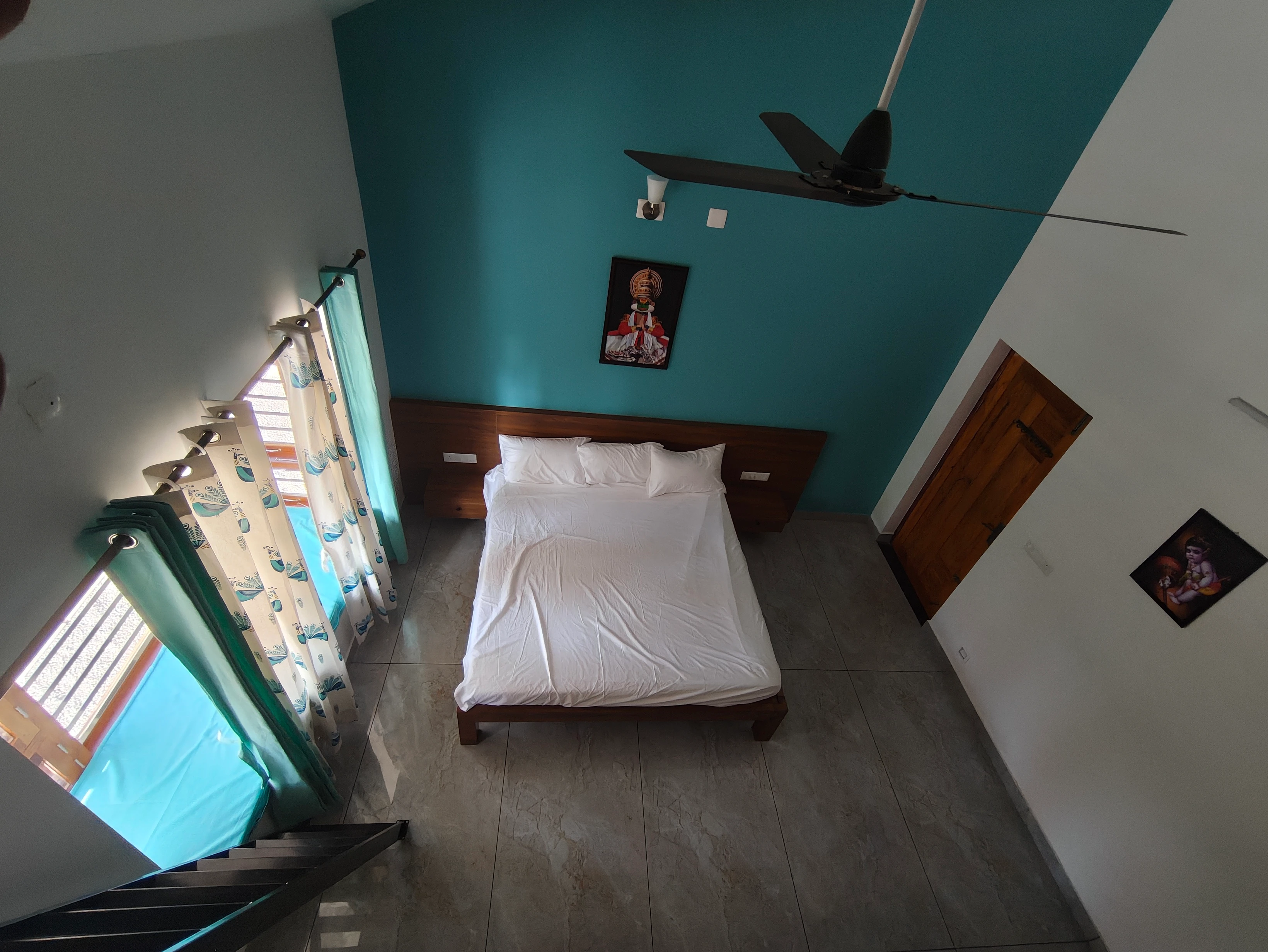 Serene Bedroom with Vibrant Teal Walls